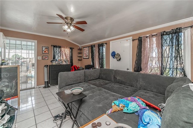 living room with light tile patterned floors, crown molding, ceiling fan, and lofted ceiling