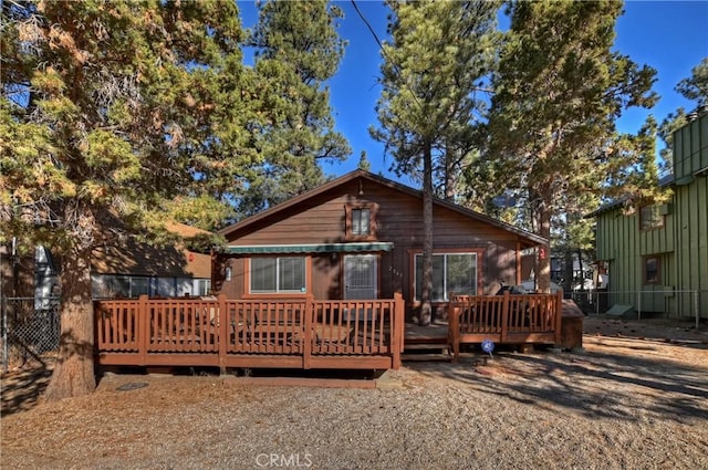 back of house featuring a deck