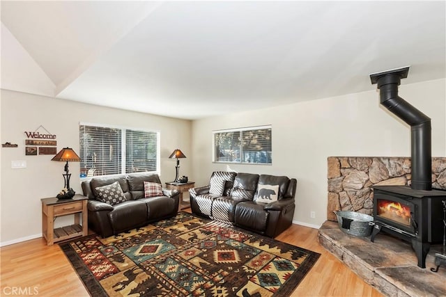 living room featuring hardwood / wood-style floors and vaulted ceiling