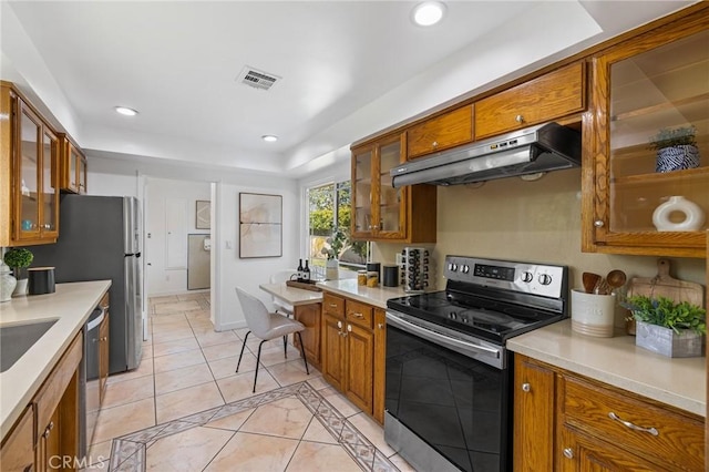 kitchen featuring sink, light tile patterned flooring, and stainless steel appliances