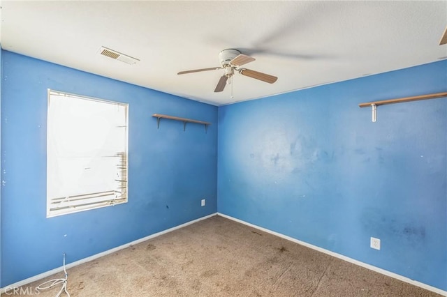 unfurnished room with carpet floors and ceiling fan