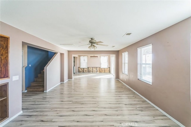 hallway with light hardwood / wood-style floors