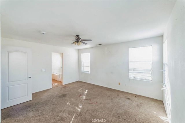 empty room featuring carpet and ceiling fan