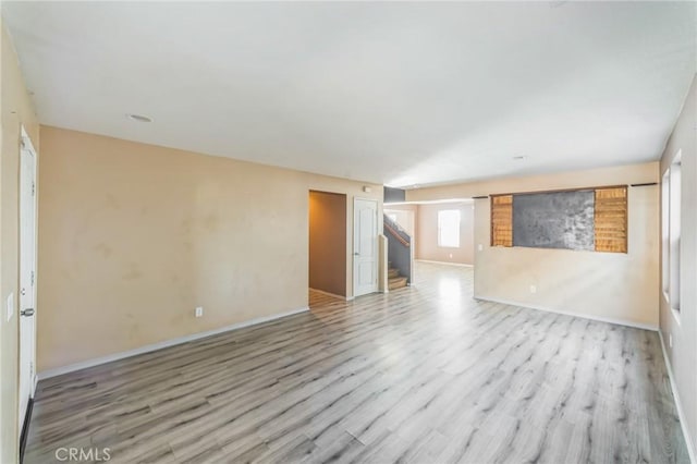 spare room featuring light hardwood / wood-style flooring