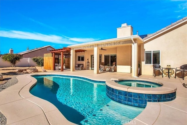 view of pool featuring an in ground hot tub, ceiling fan, and a patio area