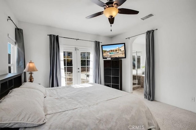 bedroom with carpet flooring, multiple windows, and ceiling fan