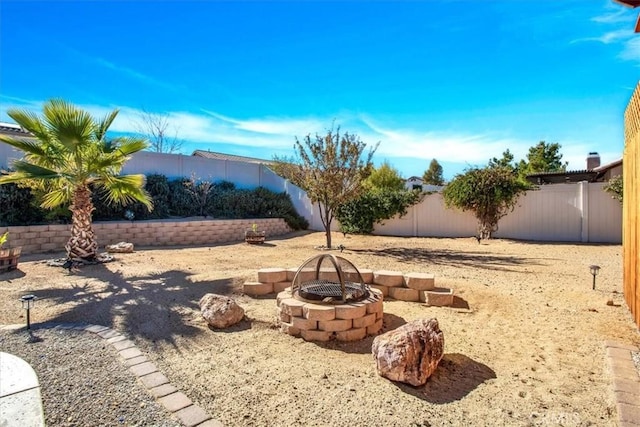 view of yard featuring a fire pit