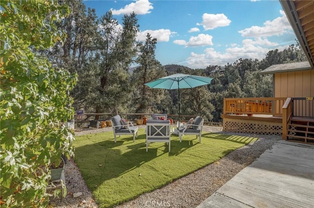 view of yard with a fire pit and a deck