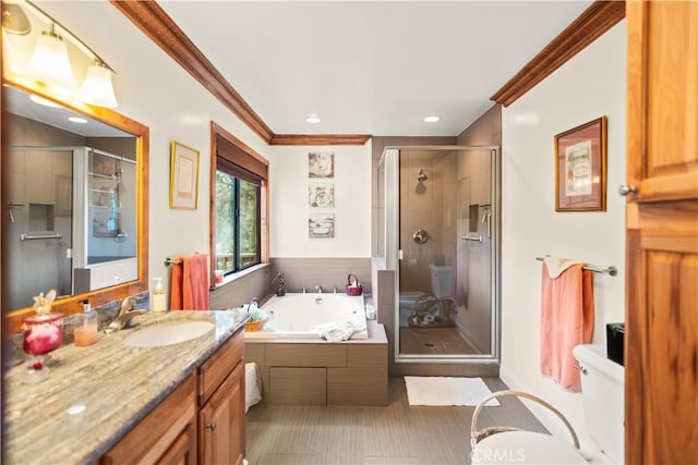 full bathroom featuring vanity, toilet, ornamental molding, and independent shower and bath