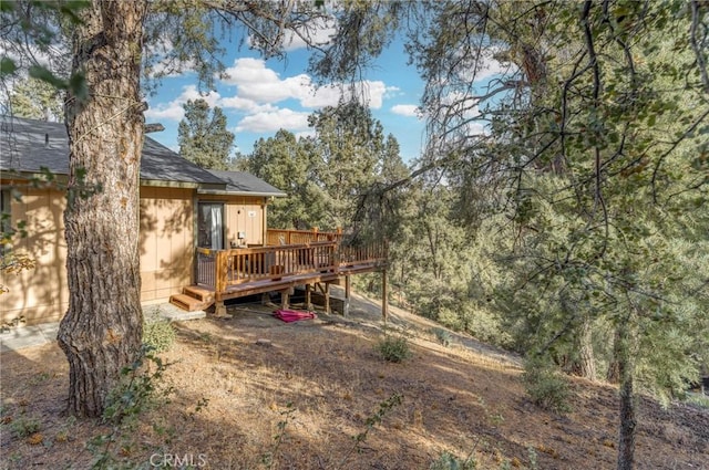 view of yard with a wooden deck