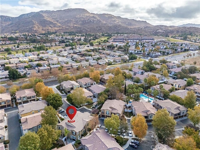 birds eye view of property with a residential view and a mountain view