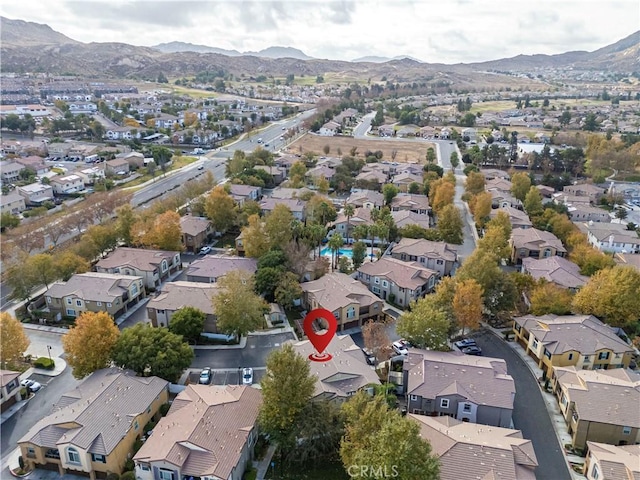 drone / aerial view featuring a residential view and a mountain view