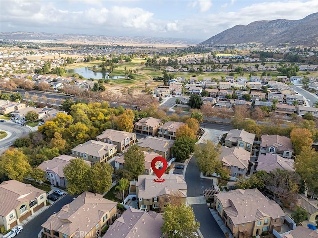 birds eye view of property with a residential view and a water and mountain view