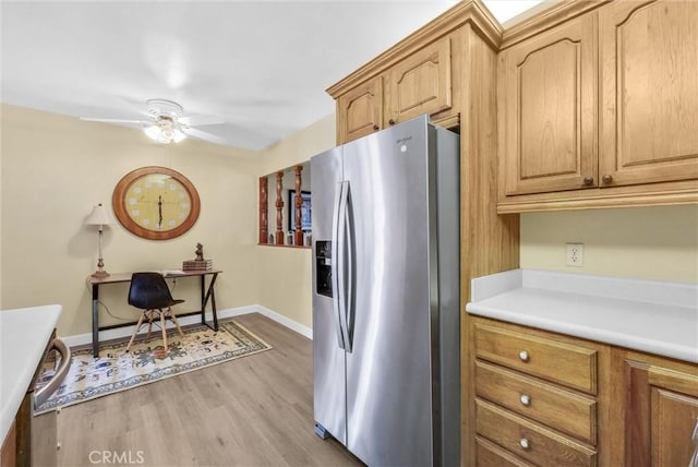 kitchen featuring ceiling fan, light hardwood / wood-style floors, and stainless steel fridge with ice dispenser