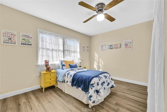 bedroom featuring hardwood / wood-style floors and ceiling fan