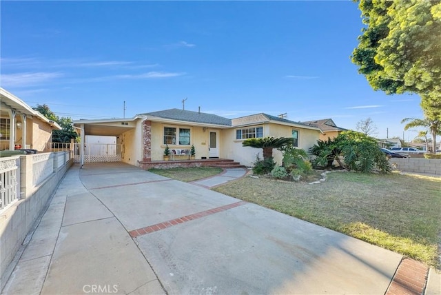 single story home with a carport and a front yard