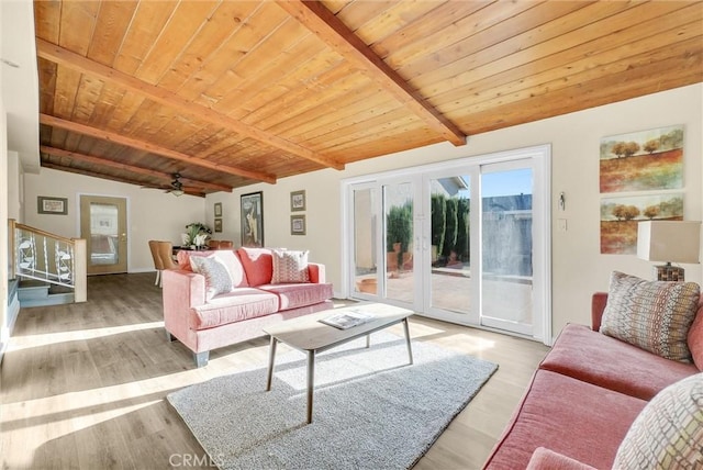 living room featuring ceiling fan, french doors, light hardwood / wood-style flooring, lofted ceiling with beams, and wood ceiling