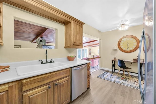 kitchen featuring ceiling fan, sink, wooden ceiling, appliances with stainless steel finishes, and light wood-type flooring