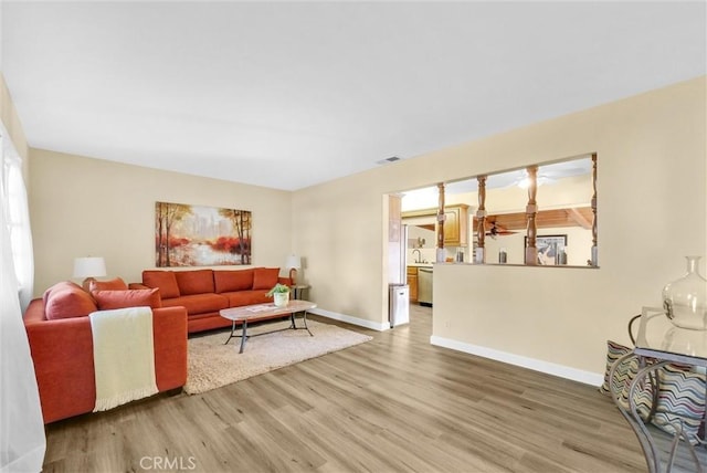 living room with sink and hardwood / wood-style flooring