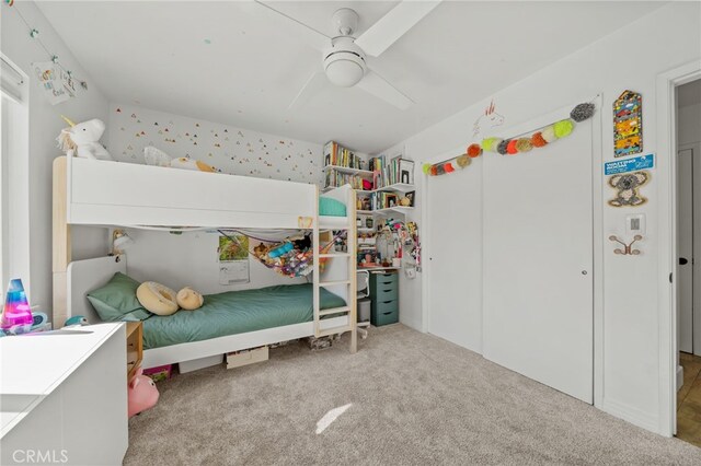 carpeted bedroom featuring ceiling fan