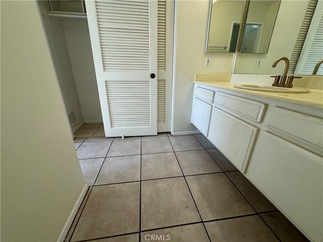 bathroom with tile patterned flooring and vanity