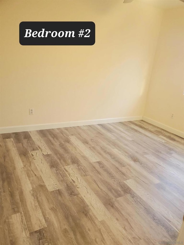 unfurnished room featuring wood-type flooring