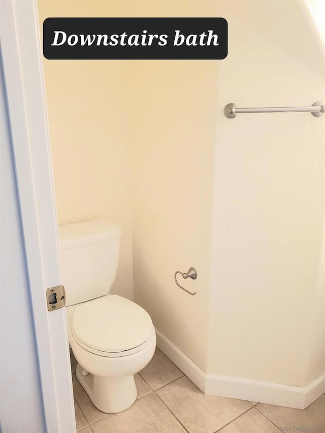 bathroom with tile patterned flooring and toilet