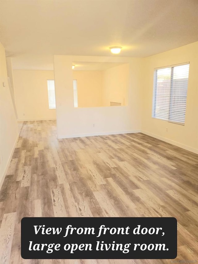 unfurnished room with hardwood / wood-style floors