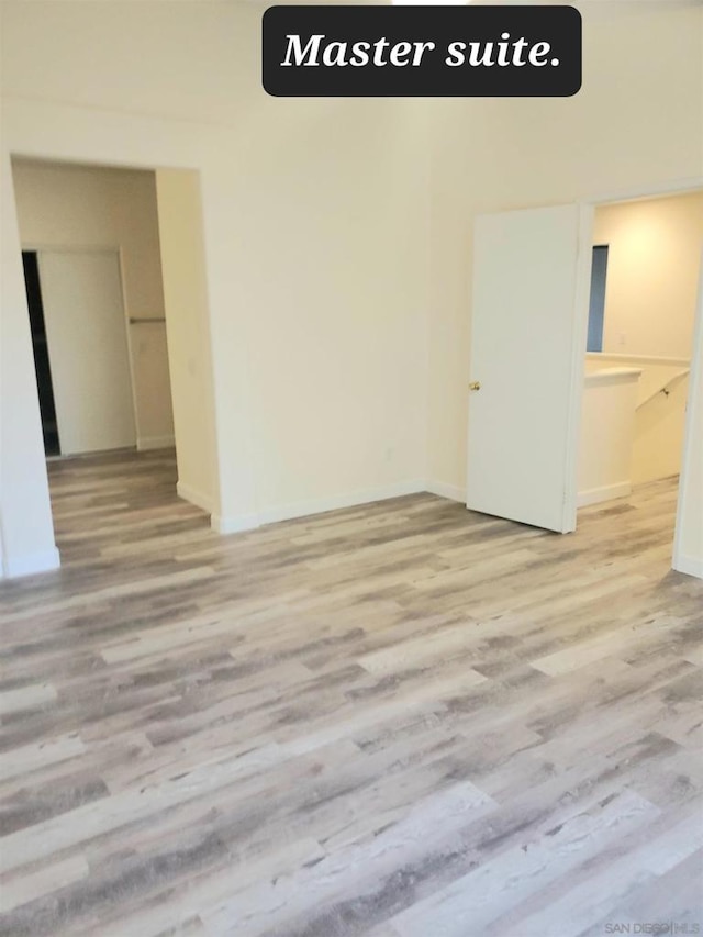 unfurnished room with light hardwood / wood-style flooring