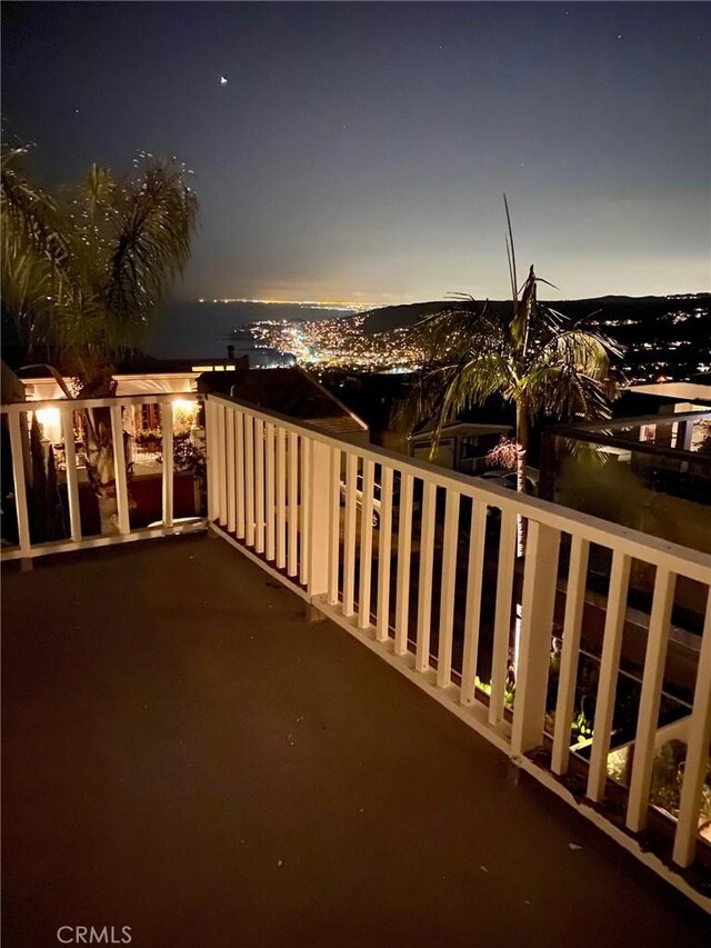 view of balcony at dusk