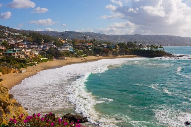 water view featuring a mountain view and a view of the beach