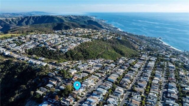 birds eye view of property featuring a water and mountain view