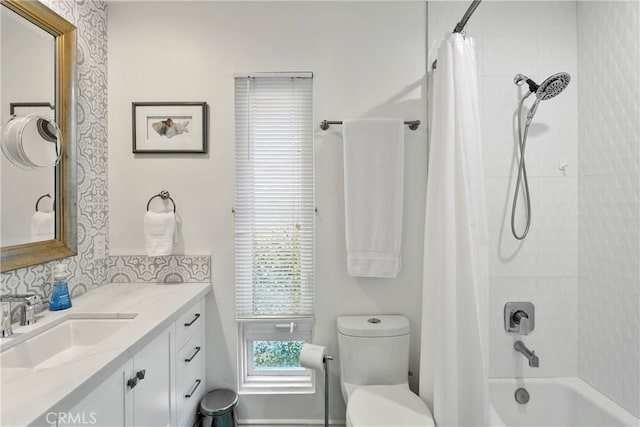 full bathroom featuring vanity, toilet, and shower / tub combo with curtain