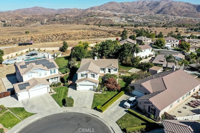 birds eye view of property featuring a mountain view