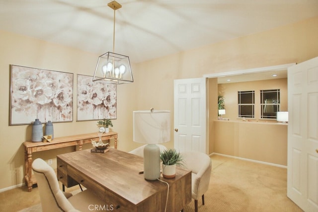 carpeted dining space with a chandelier