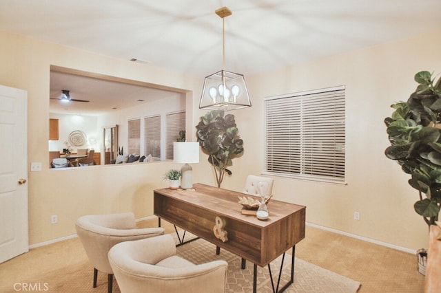 home office with light carpet and ceiling fan with notable chandelier