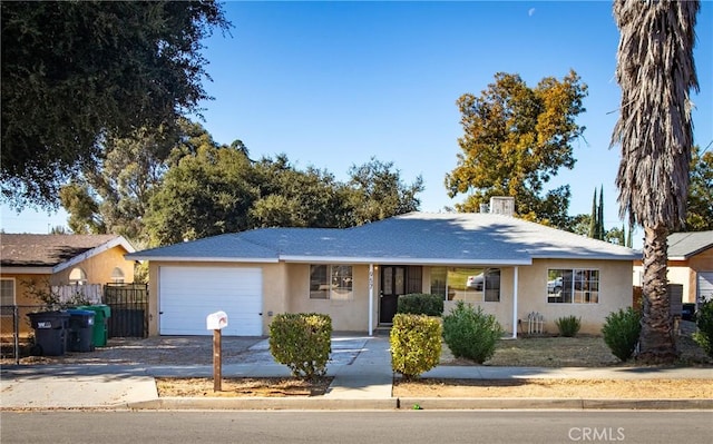 ranch-style home featuring a garage