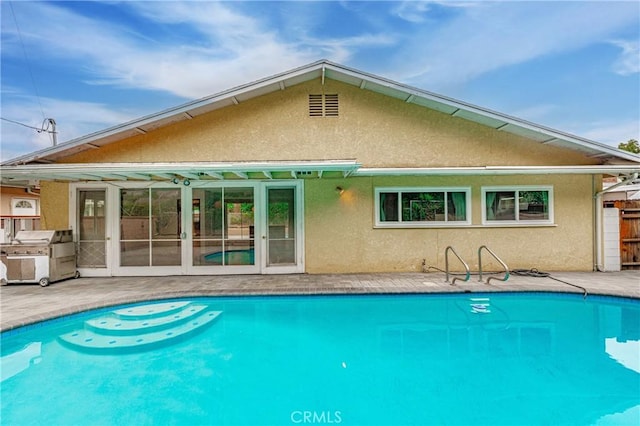 back of property with a patio area