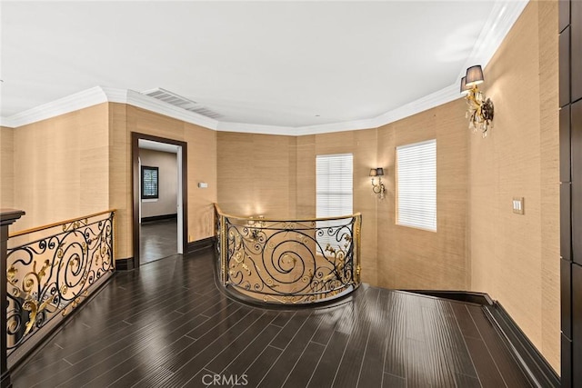 corridor featuring dark hardwood / wood-style floors and ornamental molding