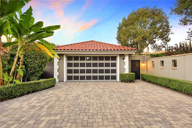 mediterranean / spanish-style house featuring a garage