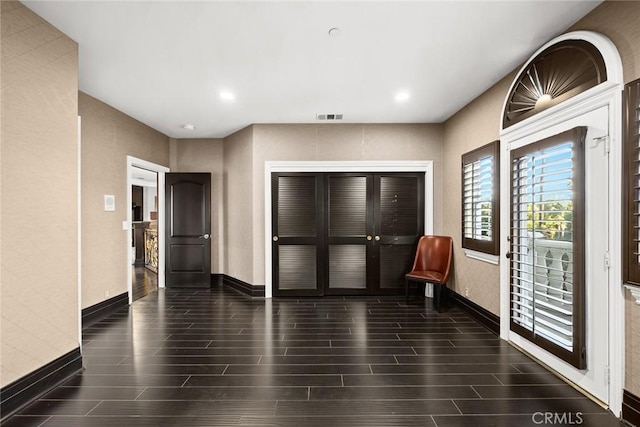 entrance foyer featuring dark hardwood / wood-style flooring