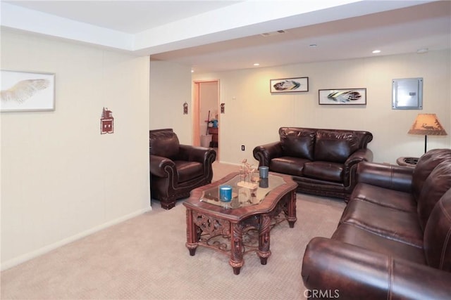 carpeted living room featuring electric panel