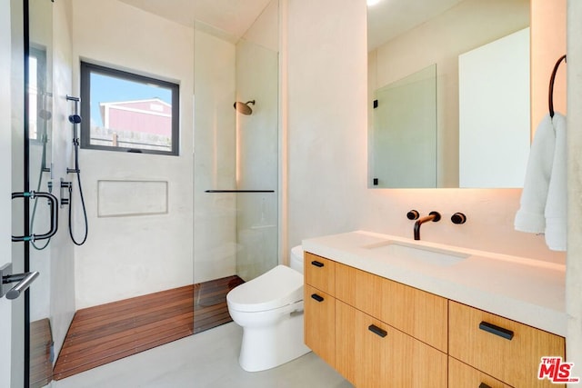 bathroom featuring an enclosed shower, vanity, toilet, and wood-type flooring