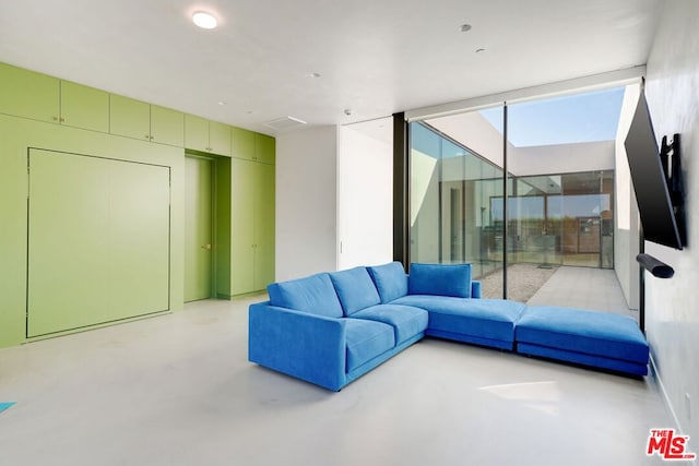 living room featuring floor to ceiling windows