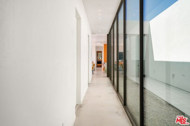 corridor with floor to ceiling windows