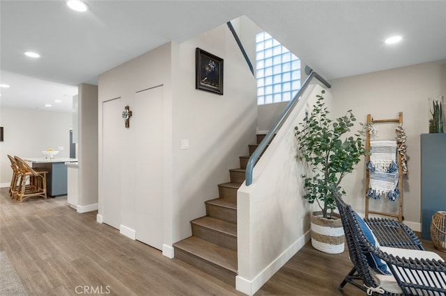 staircase with wood-type flooring