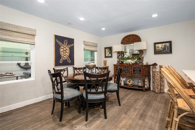 dining room with dark wood-type flooring