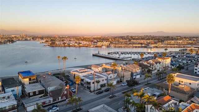 aerial view at dusk with a water view