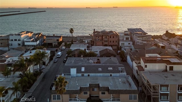 aerial view at dusk with a water view