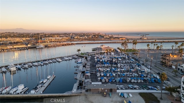 aerial view at dusk with a water view